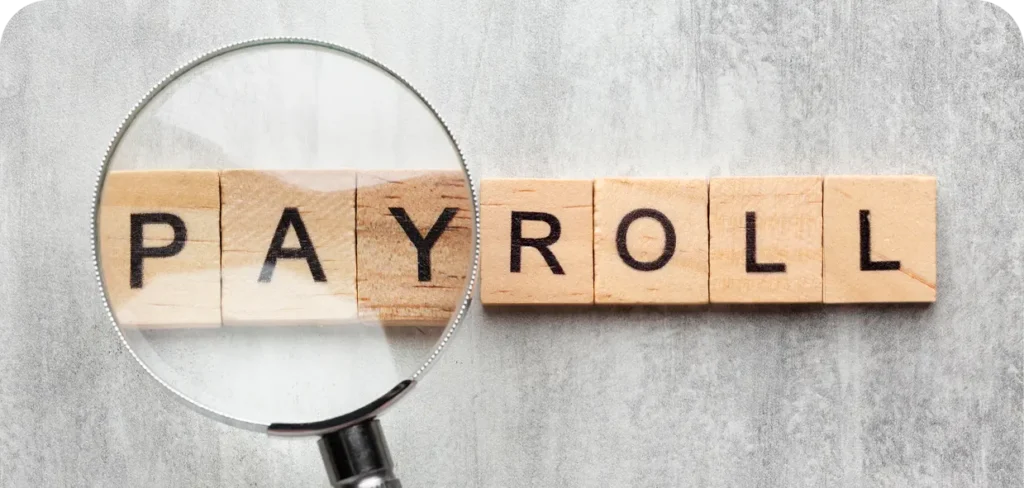 top view payroll concept with wooden cubes