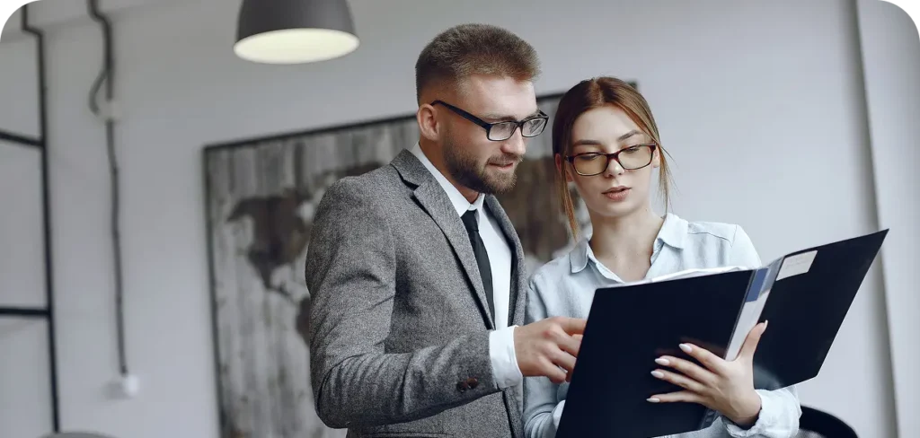 woman with glasses businessman with documents colleagues work together