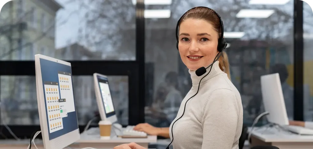 woman with headphones working call center office